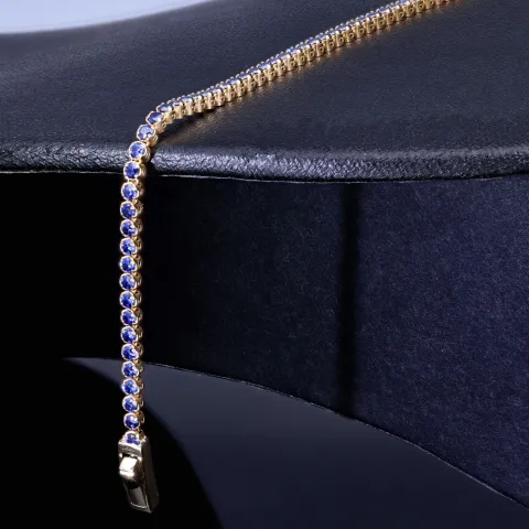 Tennisarmband mit funkelnden, dunkelblauen Zirkonia aus edlem 585 14K Gelbgold in (ca. 18,5 cm Länge)