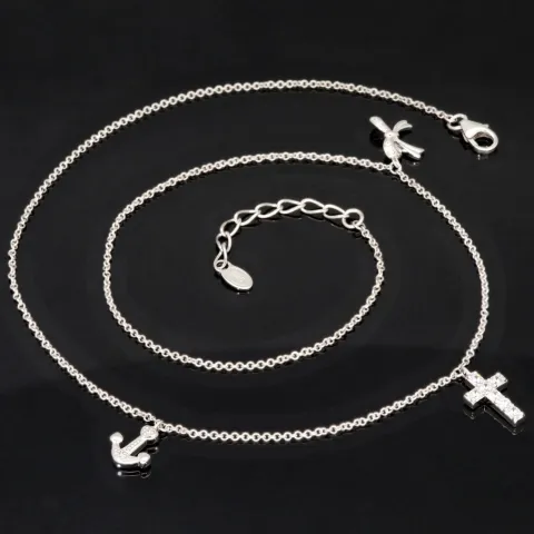Stilvolle Halskette aus rhodiniertem 925er Silber mit eingearbeiteten Charms (Kreuz, Schleife und Anker) mit Zirkoniasteinen besetzt (Diamantimitationen), ca. 42-45 länge verstellbar