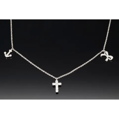 Stilvolle Halskette aus rhodiniertem 925er Silber mit eingearbeiteten Charms (Kreuz, Schleife und Anker) mit Zirkoniasteinen besetzt (Diamantimitationen), ca. 42-45 länge verstellbar