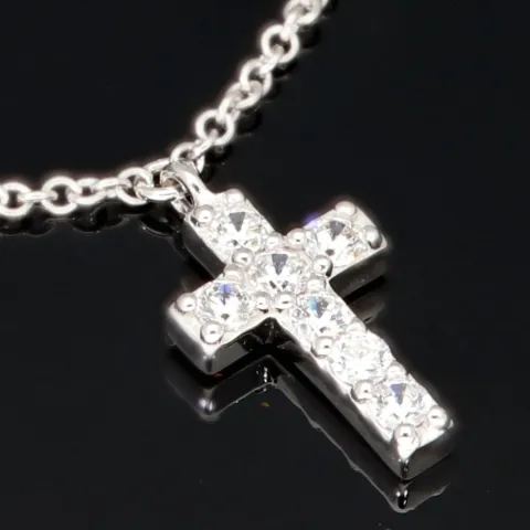 Stilvolle Halskette aus rhodiniertem 925er Silber mit eingearbeiteten Charms (Kreuz, Schleife und Anker) mit Zirkoniasteinen besetzt (Diamantimitationen), ca. 42-45 länge verstellbar