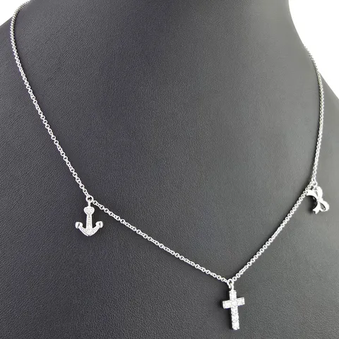 Stilvolle Halskette aus rhodiniertem 925er Silber mit eingearbeiteten Charms (Kreuz, Schleife und Anker) mit Zirkoniasteinen besetzt (Diamantimitationen), ca. 42-45 länge verstellbar