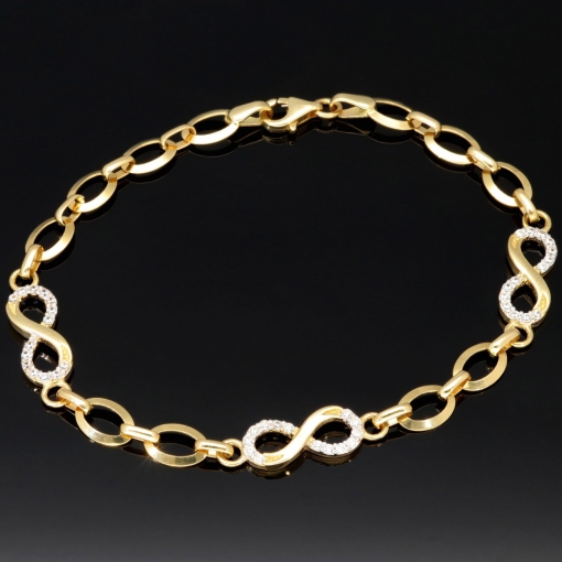 Glänzendes Goldarmband mit Infinity-Elementen mit weißen Zirkoniasteinen in 585 14K Gold in (ca. 18,5 cm Länge, ca. 6 mm Breite)