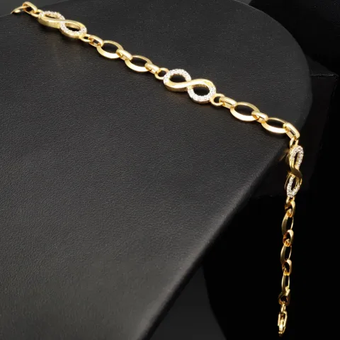 Glänzendes Goldarmband mit Infinity-Elementen mit weißen Zirkoniasteinen in 585 14K Gold in (ca. 18,5 cm Länge, ca. 6 mm Breite)