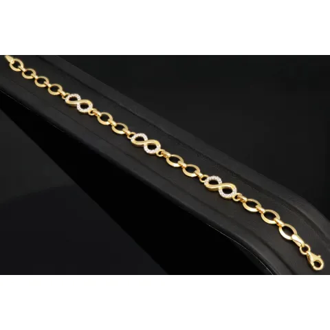 Glänzendes Goldarmband mit Infinity-Elementen mit weißen Zirkoniasteinen in 585 14K Gold in (ca. 18,5 cm Länge, ca. 6 mm Breite)