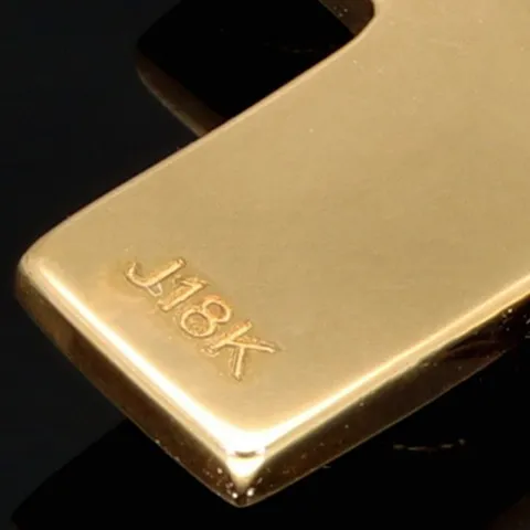Massiver Kreuz-Anhänger mit eingefassten, funkelnden, kolumbianischen Smaragd in aufwendigem Rundschliff (ca. 0,29 ct.) in edlem Gold (750 18K Gelbgold)