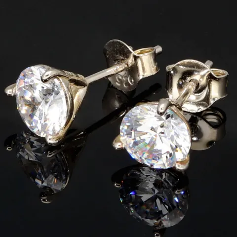 Zeitlos schöne Ohrstecker aus rhodiniertem 925er Sterling Silber, die mit brillant geschliffenen Zirkonia (Diamantimitation)