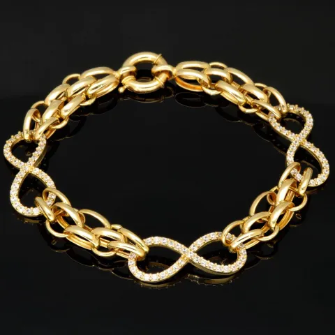 Exklusives Goldarmband mit eingearbeiteten Unendlichkeits-Elementen präzise besetzt mit weißen Zirkoniasteinen in 585 14K Gold in (ca. 20 cm Länge, ca. 9 mm Breite)