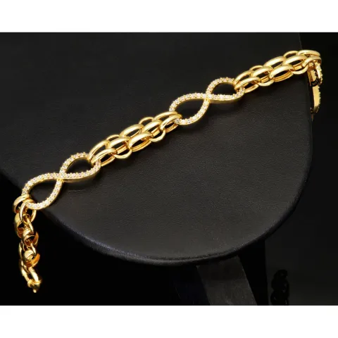 Exklusives Goldarmband mit eingearbeiteten Unendlichkeits-Elementen präzise besetzt mit weißen Zirkoniasteinen in 585 14K Gold in (ca. 20 cm Länge, ca. 9 mm Breite)