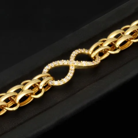 Exklusives Goldarmband mit eingearbeiteten Unendlichkeits-Elementen präzise besetzt mit weißen Zirkoniasteinen in 585 14K Gold in (ca. 20 cm Länge, ca. 9 mm Breite)