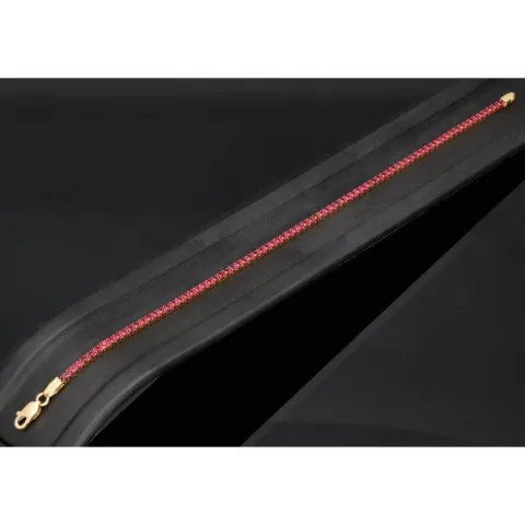 Fein gearbeitetes Tennisarmband aus edlem 585 / 14K Gold mit funkelnden pink-lila Zirkoniasteinen besetzt (ca. 17,5 cm)