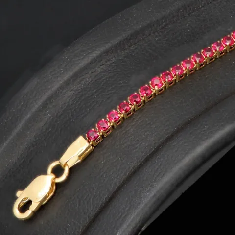 Fein gearbeitetes Tennisarmband aus edlem 585 / 14K Gold mit funkelnden pink-lila Zirkoniasteinen besetzt (ca. 17,5 cm)