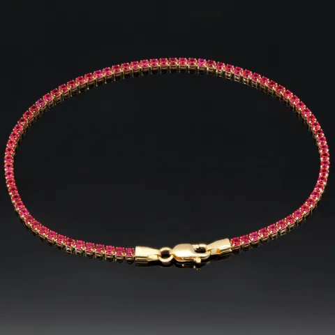 Fein gearbeitetes Tennisarmband aus edlem 585 / 14K Gold mit funkelnden pink-lila Zirkoniasteinen besetzt (ca. 17,5 cm)