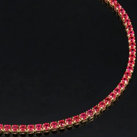Fein gearbeitetes Tennisarmband aus edlem 585 / 14K Gold mit funkelnden pink-lila Zirkoniasteinen besetzt (ca. 17,5 cm)