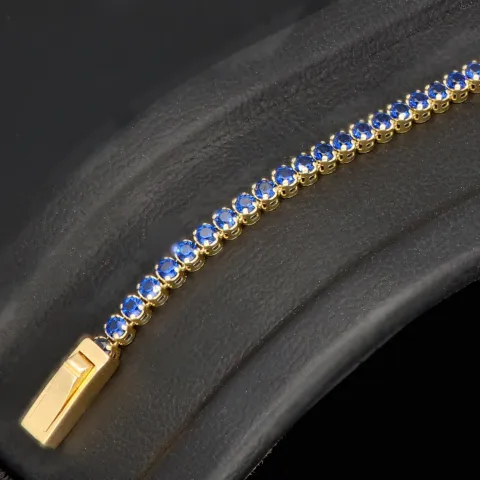 Trendiges Tennisarmband mit funkelnden, dunkelblauen Zirkonia aus hochwertigem 14K 585er Gold in (ca. 18,5 cm Länge)