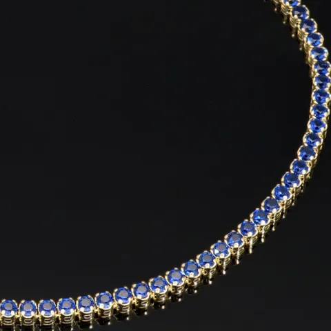 Trendiges Tennisarmband mit funkelnden, dunkelblauen Zirkonia aus hochwertigem 14K 585er Gold in (ca. 18,5 cm Länge)