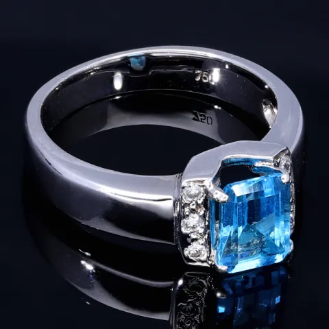 Ring für Damen in 750 18 Karat Weißgold mit 6 Brillanten und einem intensiv türkisen, großen Topas - Stein handgefertigt in Ringgröße 58