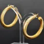 Twist - Creolen in zeitlosem Design aus funkelndem 333er / 8K Gold