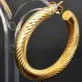 Twist - Creolen in zeitlosem Design aus funkelndem 333er / 8K Gold
