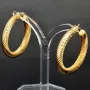 Twist - Creolen in zeitlosem Design aus funkelndem 333er / 8K Gold