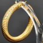 Twist - Creolen in zeitlosem Design aus funkelndem 333er / 8K Gold