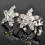 Glänzende Stern-Ohrstecker aus hochwertigem 925er Sterlingsilber mit funkelnden Zirkonia in Krappen gefasst