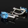 Edle Ohrringe / Ohrboutons aus 925 Sterling Silber bestückt mit 2 großen, leuchtenden blauen Zirkoniasteinen und 10 brillantgeschliffene, strahlende weiße Zirkonia