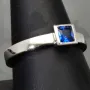 Stilvoller Ring mit saphirblauen prinzessgeschliffenem Stein in Zargenfassung aus Sterling Silber 925 - RG ca. 60