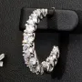 Trendige Creolen / Ohrringe aus 925er Silber, rhodiniert und poliert, besetzt mit funkelnden Zirkonia-Steinen (gesamt ca. 3,20 Karat) im Brillantschliff