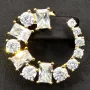 Exklusive Creolen in stilvollem Design aus vergoldetem 925 Sterling Silber mit 26 leuchtenden Zirkonia (im Schliffmix, Brillantschliff und Baguetteschliff)
