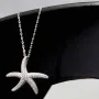Maritime Seestern-Kette mit vielen kleinen, funkelnden Zirkonia-Steinen (Diamatimitate, Brillantschliff) aus 925 Sterling Silber poliert und rhodiniert - Länge verstellbar 45-50 cm