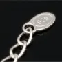 Stilvolle Halskette aus rhodiniertem 925er Silber mit eingearbeiteten Charms (Kreuz, Schleife und Anker) mit Zirkoniasteinen besetzt (Diamantimitationen), ca. 42-45 länge verstellbar