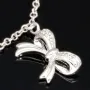 Stilvolle Halskette aus rhodiniertem 925er Silber mit eingearbeiteten Charms (Kreuz, Schleife und Anker) mit Zirkoniasteinen besetzt (Diamantimitationen), ca. 42-45 länge verstellbar