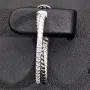 Glänzende Creolen / Ohrringe aus 925 Silber, rhodiniert und poliert, besetzt mit vielen, kleinen funkelnden Zirkonia-Steinen im Brillantschliff