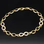 Glänzendes Goldarmband mit Infinity-Elementen mit weißen Zirkoniasteinen in 585 14K Gold in (ca. 18,5 cm Länge, ca. 6 mm Breite)