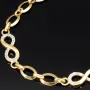Glänzendes Goldarmband mit Infinity-Elementen mit weißen Zirkoniasteinen in 585 14K Gold in (ca. 18,5 cm Länge, ca. 6 mm Breite)