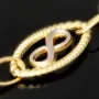 Bicolor-Ankerarmband aus 14K (585) Gold – Kombination aus Gelb- und Weißgold mit filigran gearbeiteten Infinity-Elementen (ca. 20,5 cm)