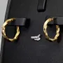 Glänzende Greco-Creolen in zeitlosem Twist-Design aus funkelndem 585er / 14K Gold