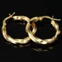 Glänzende Greco-Creolen in zeitlosem Twist-Design aus funkelndem 585er / 14K Gold