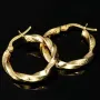 Glänzende Greco-Creolen in zeitlosem Twist-Design aus funkelndem 585er / 14K Gold