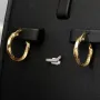 Glänzende Twist - Creolen in stilvollem Greco - Design aus hochwertigem Gold (585 / 14K Gelbgold)