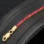 Fein gearbeitetes Tennisarmband aus edlem 585 / 14K Gold mit funkelnden pink-lila Zirkoniasteinen besetzt (ca. 17,5 cm)