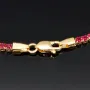Fein gearbeitetes Tennisarmband aus edlem 585 / 14K Gold mit funkelnden pink-lila Zirkoniasteinen besetzt (ca. 17,5 cm)