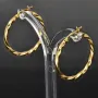 Glänzend polierte Twist - Creolen aus edlem Gold (14K 585 Gelbgold)