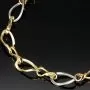 Hochglanzpoliertes Bicolor-Goldarmband aus funkelndem 14K 585 Gelb- und Weißgold mit harmonisch verschlungenen Unendlichkeitssymbolen (ca. 20cm, 7mm)