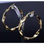 Exquisite Twist - Creolen mit filgranem Greco - Design aus 585er (14K) Gelbgold