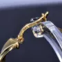 Exquisite Twist - Creolen mit filgranem Greco - Design aus 585er (14K) Gelbgold