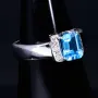 Ring für Damen in 750 18 Karat Weißgold mit 6 Brillanten und einem intensiv türkisen, großen Topas - Stein handgefertigt in Ringgröße 58