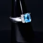 Ring für Damen in 750 18 Karat Weißgold mit 6 Brillanten und einem intensiv türkisen, großen Topas - Stein handgefertigt in Ringgröße 58