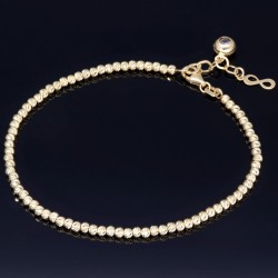 Längenverstellbares Infinity-Armband bestehend aus vielen kleinen Goldkügelchen aus 585 14K Gelbgold in ca. 18,5 - 20 cm Länge mit Zirkoniastein