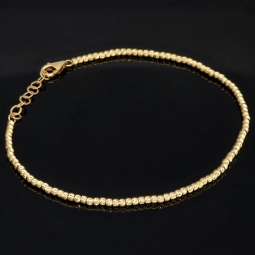 Längenverstellbares Armband, mit vielen kleinen Goldkügelchen bestückt, aus 585 14K Gelbgold in ca. 17,5 - 20 cm Länge